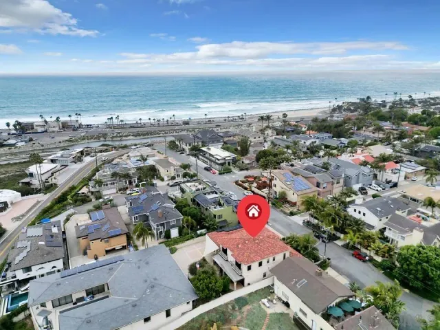 a view of a patio with table and chairs a barbeque with wooden floor and fence