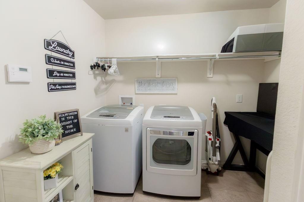 544 Madrone Trail Forney, TX 75126 - Photo 12 of 23 a utility room with dryer and washer