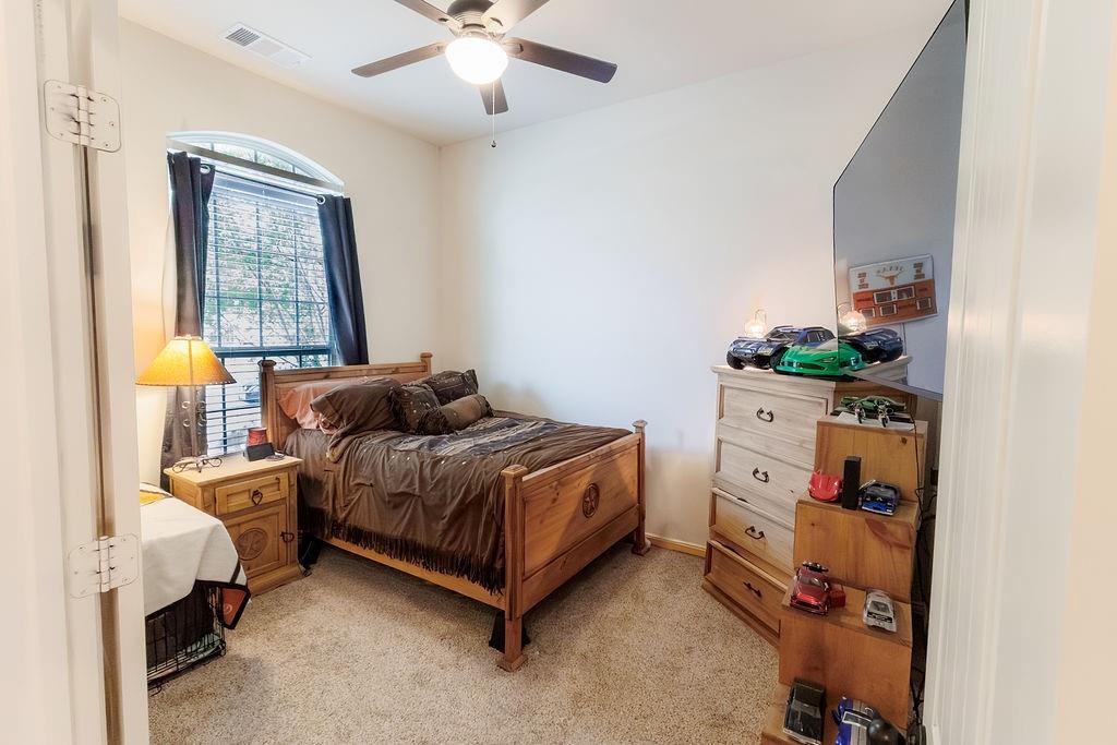 544 Madrone Trail Forney, TX 75126 - Photo 16 of 23 a bedroom with a bed and a window