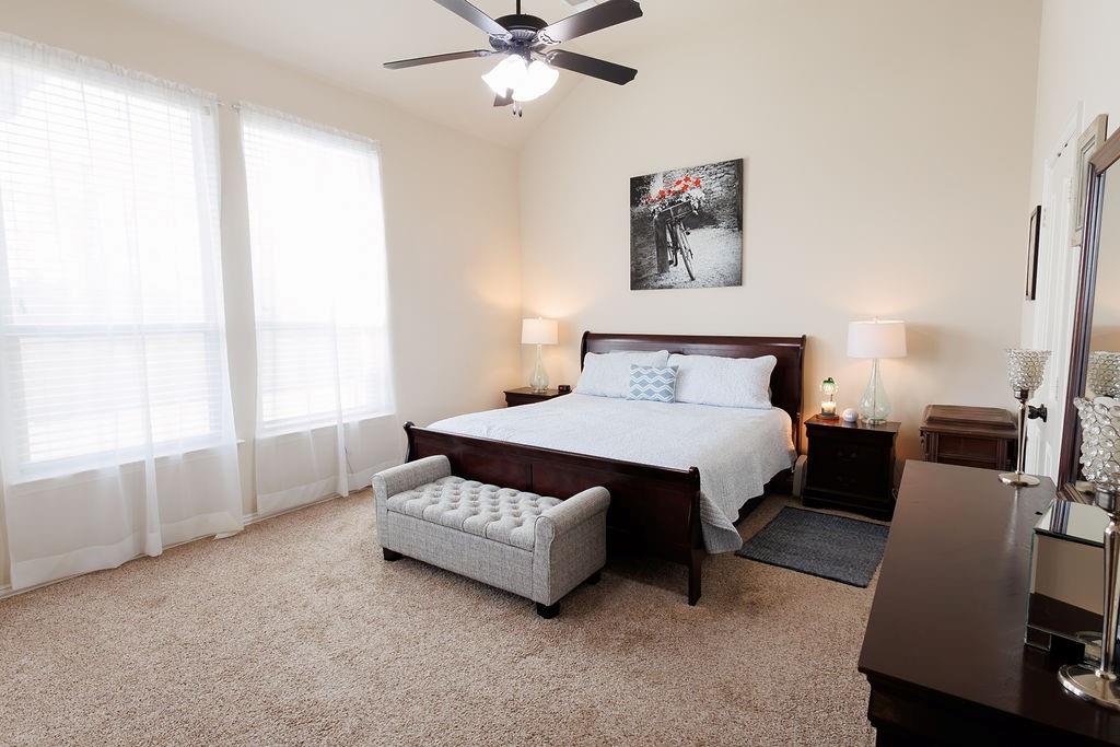 544 Madrone Trail Forney, TX 75126 - Photo 18 of 23 a spacious bedroom with a bed and window