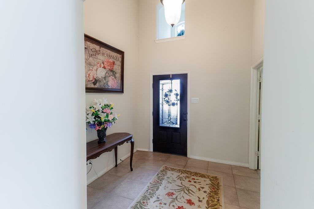 544 Madrone Trail Forney, TX 75126 - Photo 2 of 23 a living room with furniture and a rug