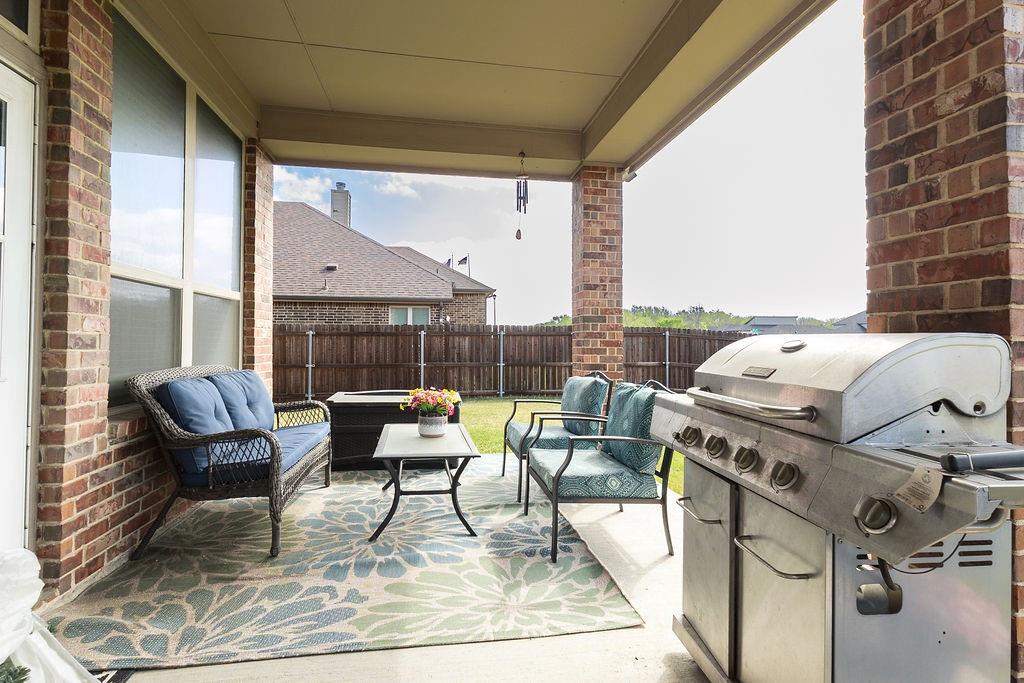 544 Madrone Trail Forney, TX 75126 - Photo 21 of 23 a living room with furniture and a large window