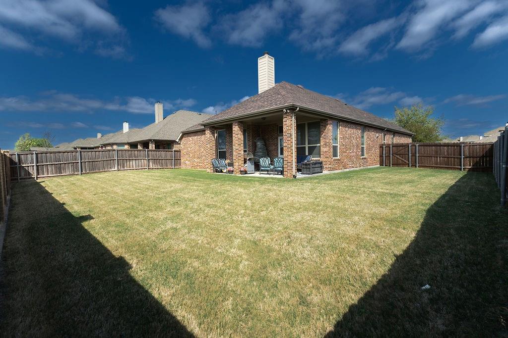 544 Madrone Trail Forney, TX 75126 - Photo 22 of 23 a view of a house with a yard
