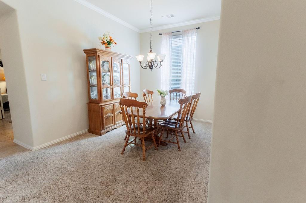 544 Madrone Trail Forney, TX 75126 - Photo 4 of 23 a view of a dining room with furniture and window