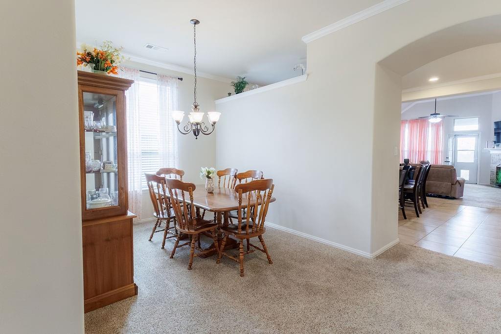 544 Madrone Trail Forney, TX 75126 - Photo 5 of 23 a view of a dining room with furniture