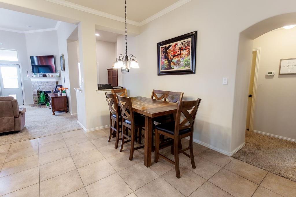 544 Madrone Trail Forney, TX 75126 - Photo 7 of 23 a dining room with furniture and chandelier