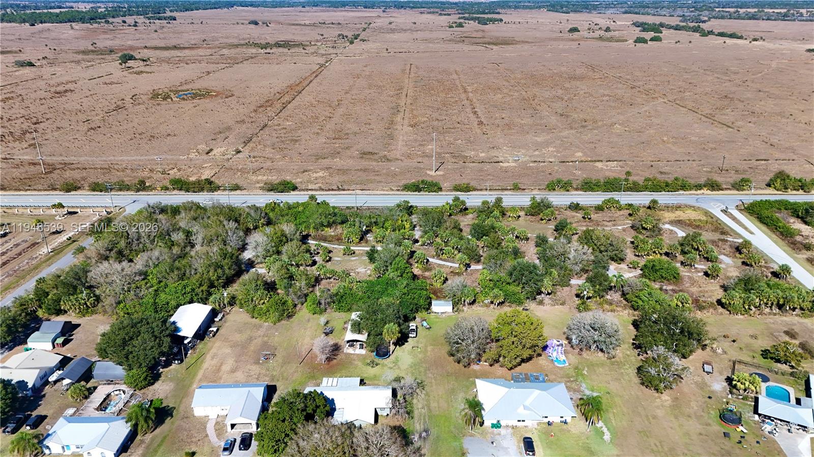 8636 Highway 70 Okeechobee, FL 34974 - Photo 3 of 5 an aerial view of a house with a yard