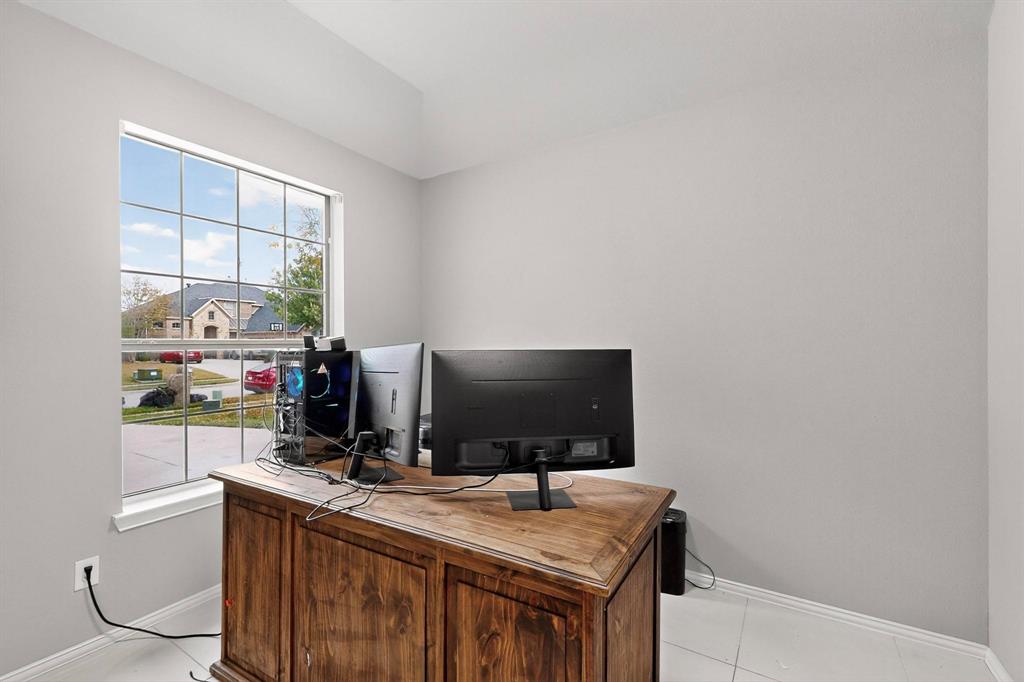 1122 Leafy Glade Road Forney, TX 75126 - Photo 17 of 19 a view of a workspace with furniture