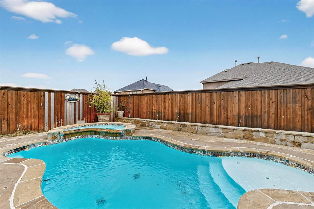 1122 Leafy Glade Road Forney, TX 75126 - Photo 19 of 19 a view of a swimming pool with a patio and a yard