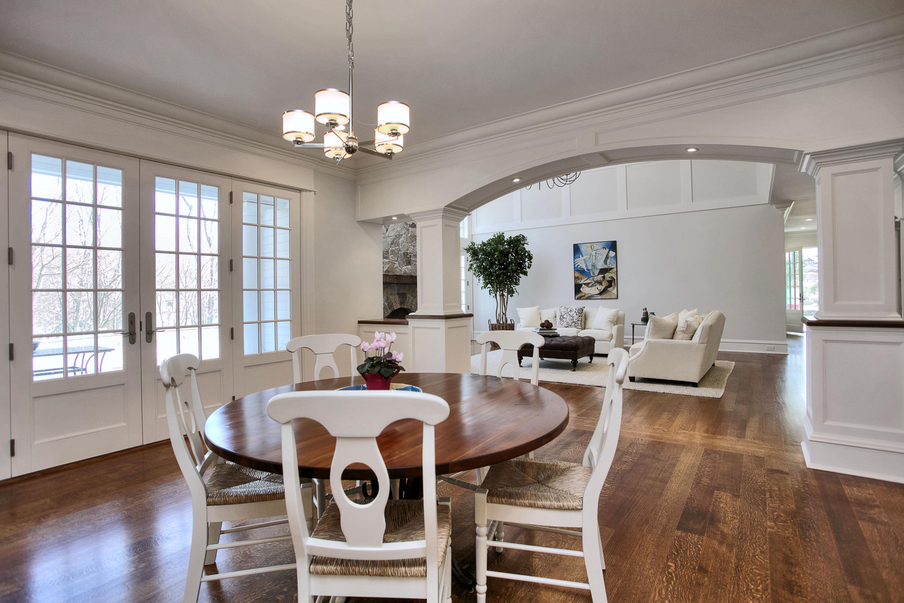 1385 Smith Ridge Road New Canaan, CT 06840 - Photo 13 of 33 a view of a dining room with furniture a chandelier and wooden floor
