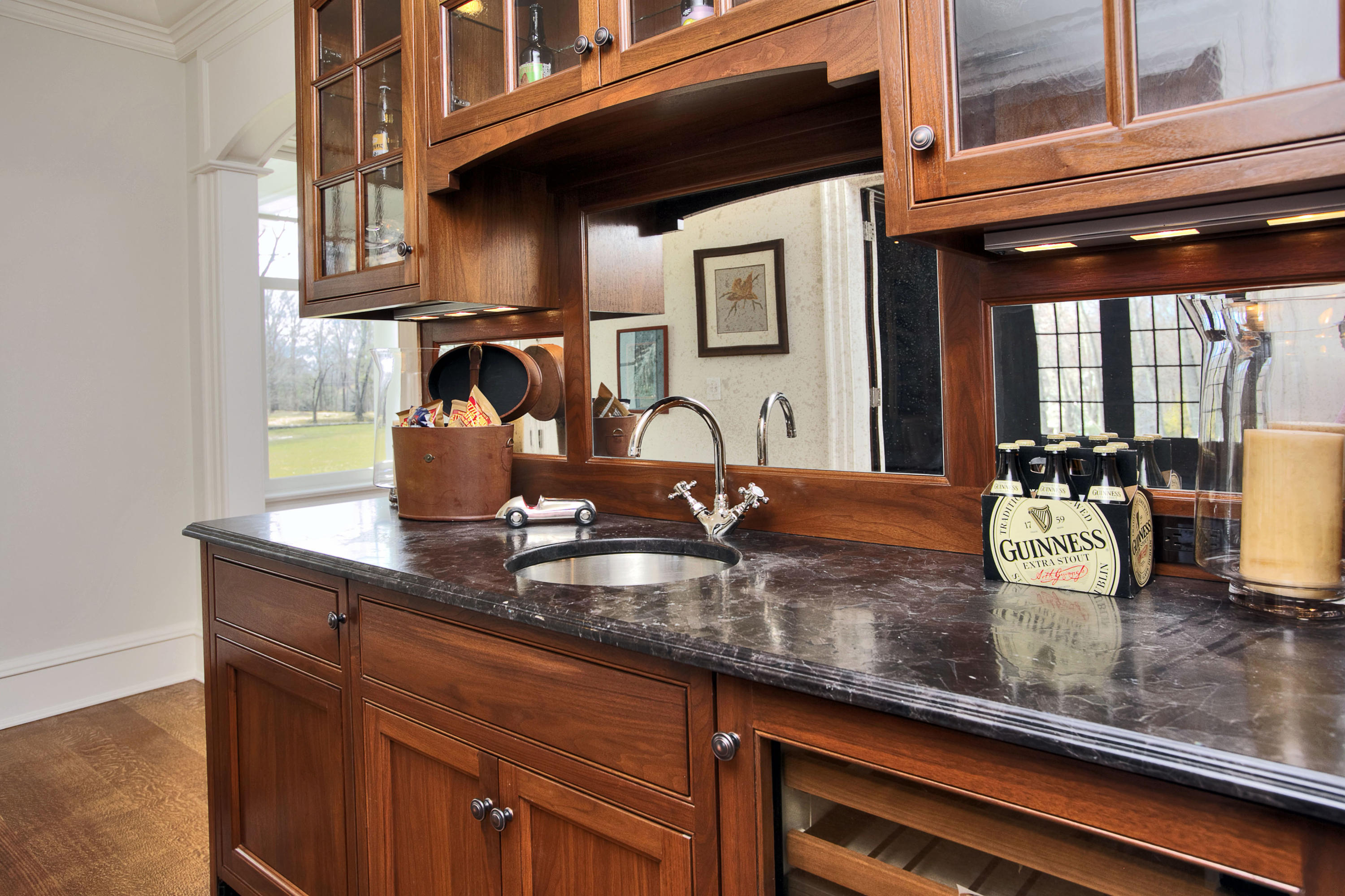 1385 Smith Ridge Road New Canaan, CT 06840 - Photo 16 of 33 a kitchen with granite countertop a sink and cabinets