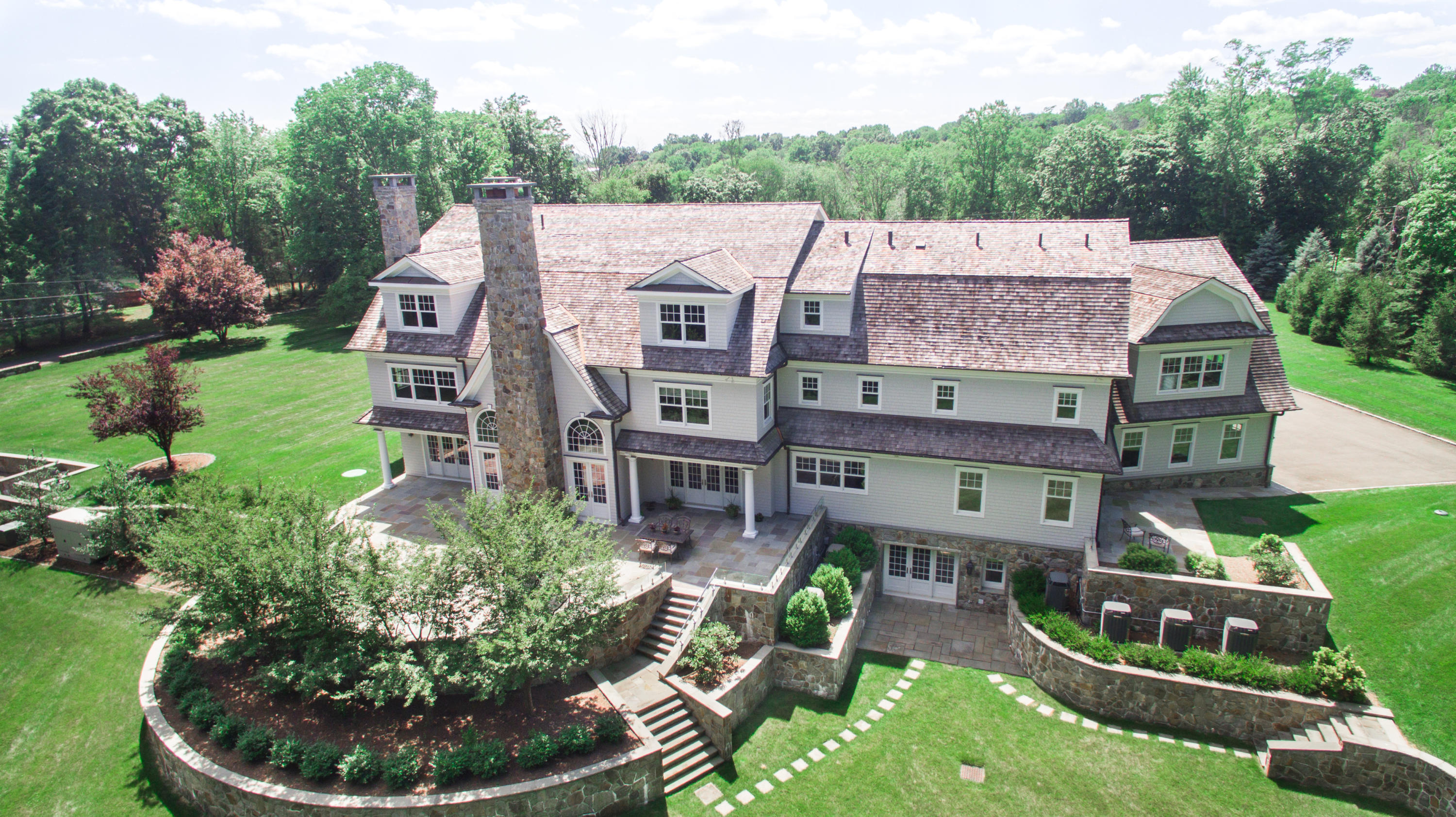 1385 Smith Ridge Road New Canaan, CT 06840 - Photo 2 of 33 an aerial view of a house with garden space and street view