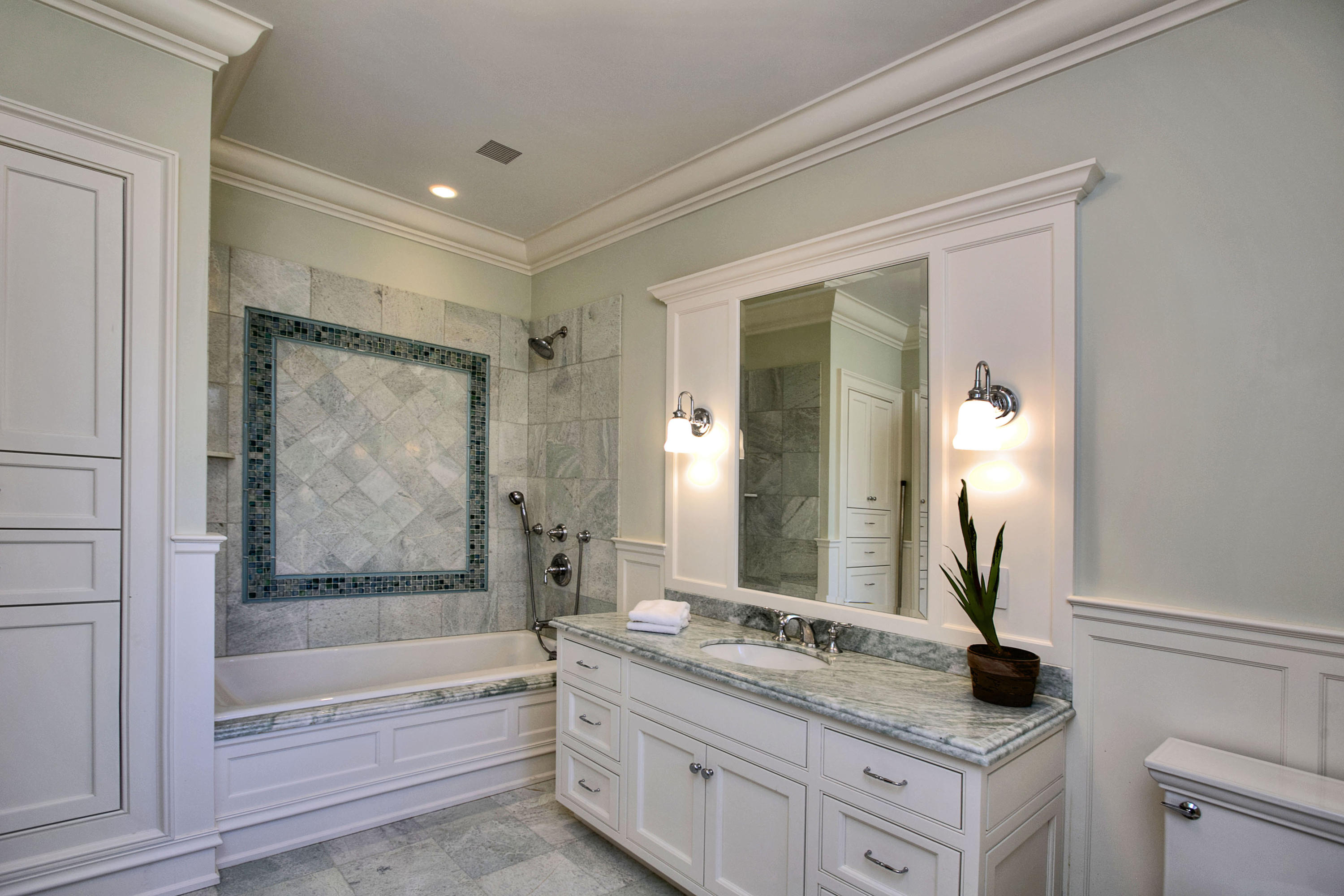 1385 Smith Ridge Road New Canaan, CT 06840 - Photo 26 of 33 a bathroom with a granite countertop sink a mirror and a bathtub