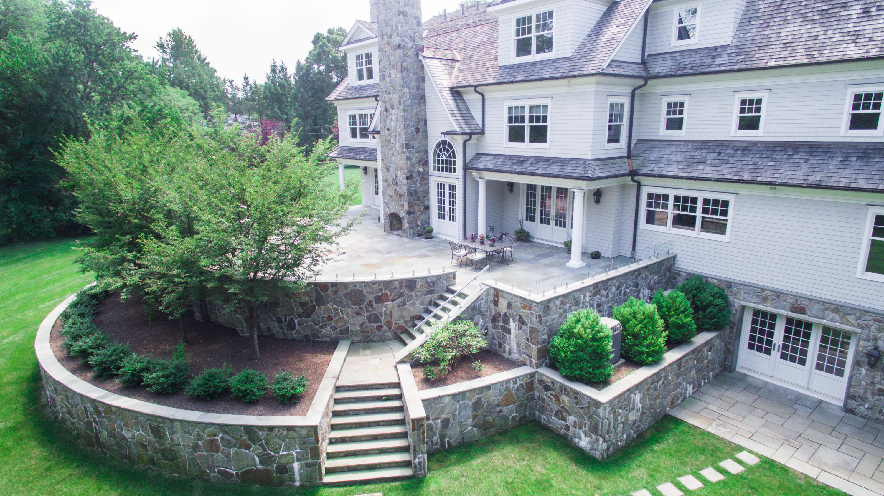 1385 Smith Ridge Road New Canaan, CT 06840 - Photo 30 of 33 a aerial view of a house with a yard and potted plants
