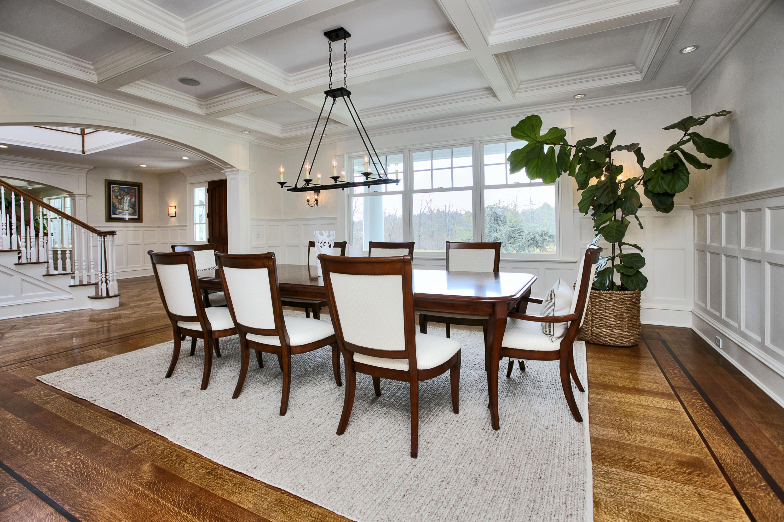 1385 Smith Ridge Road New Canaan, CT 06840 - Photo 7 of 33 a dining room with furniture a chandelier and wooden floor