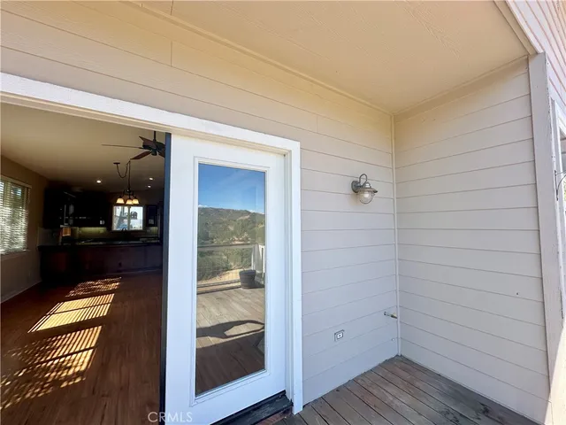 a bathroom with a glass door shower and a sink