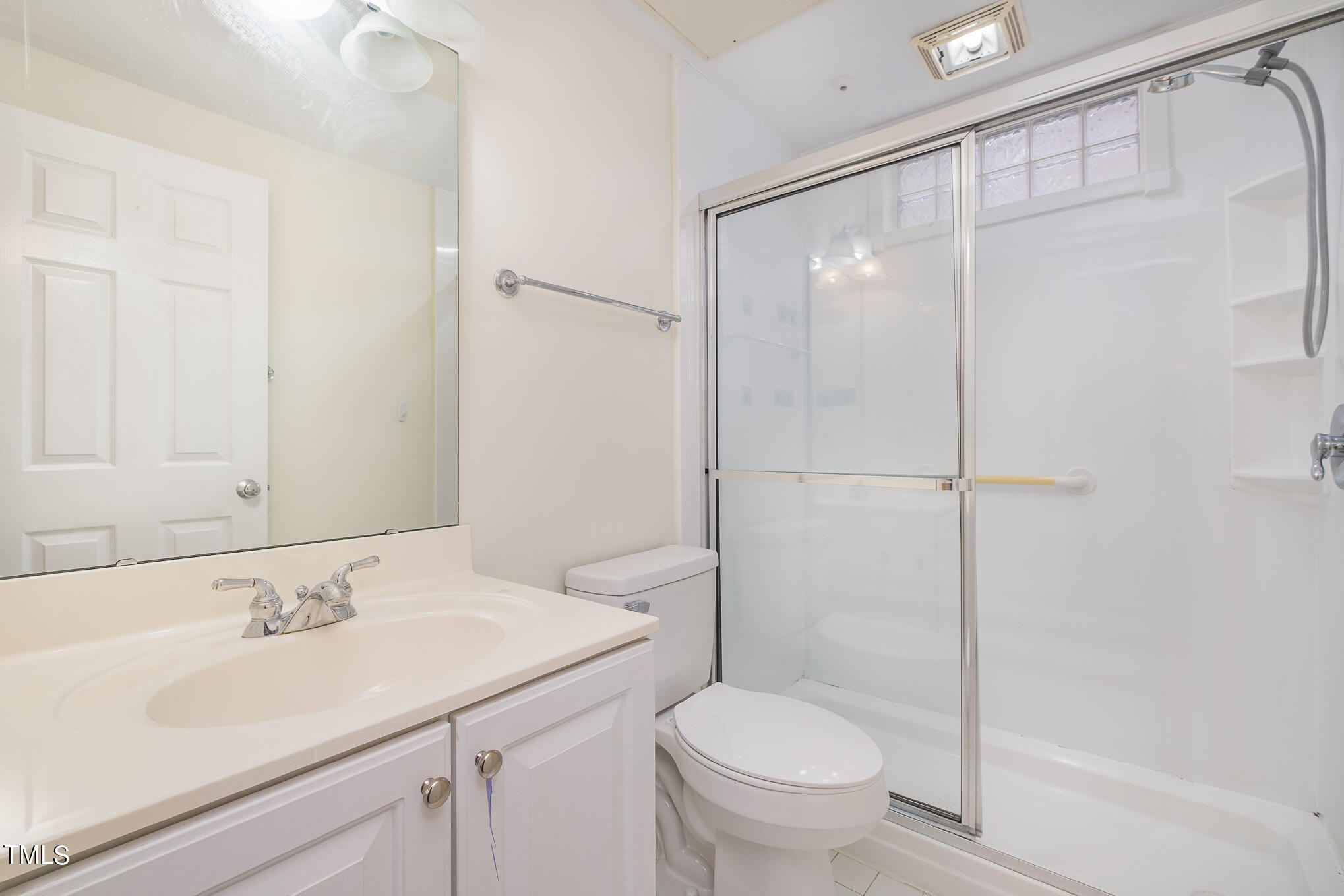 2651 Mellowfield Drive, Unit 107 Raleigh, NC 27604 - Photo 15 of 15 a bathroom with a sink toilet and shower