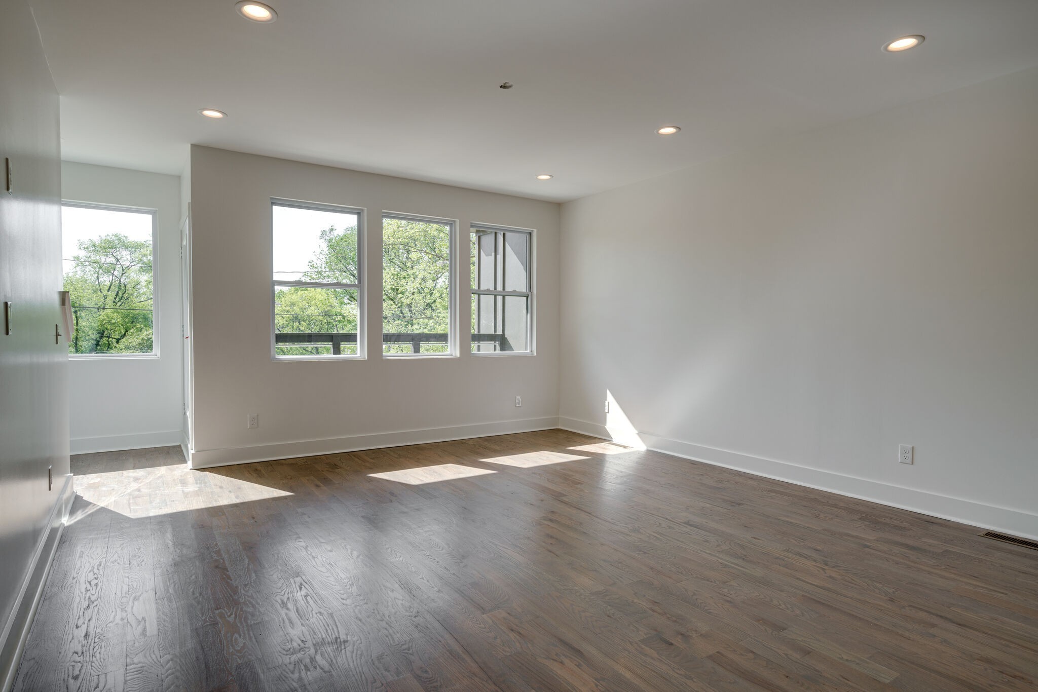 2005 Overby Road Nashville, TN 37207 - Photo 12 of 36 an empty room with wooden floor and windows