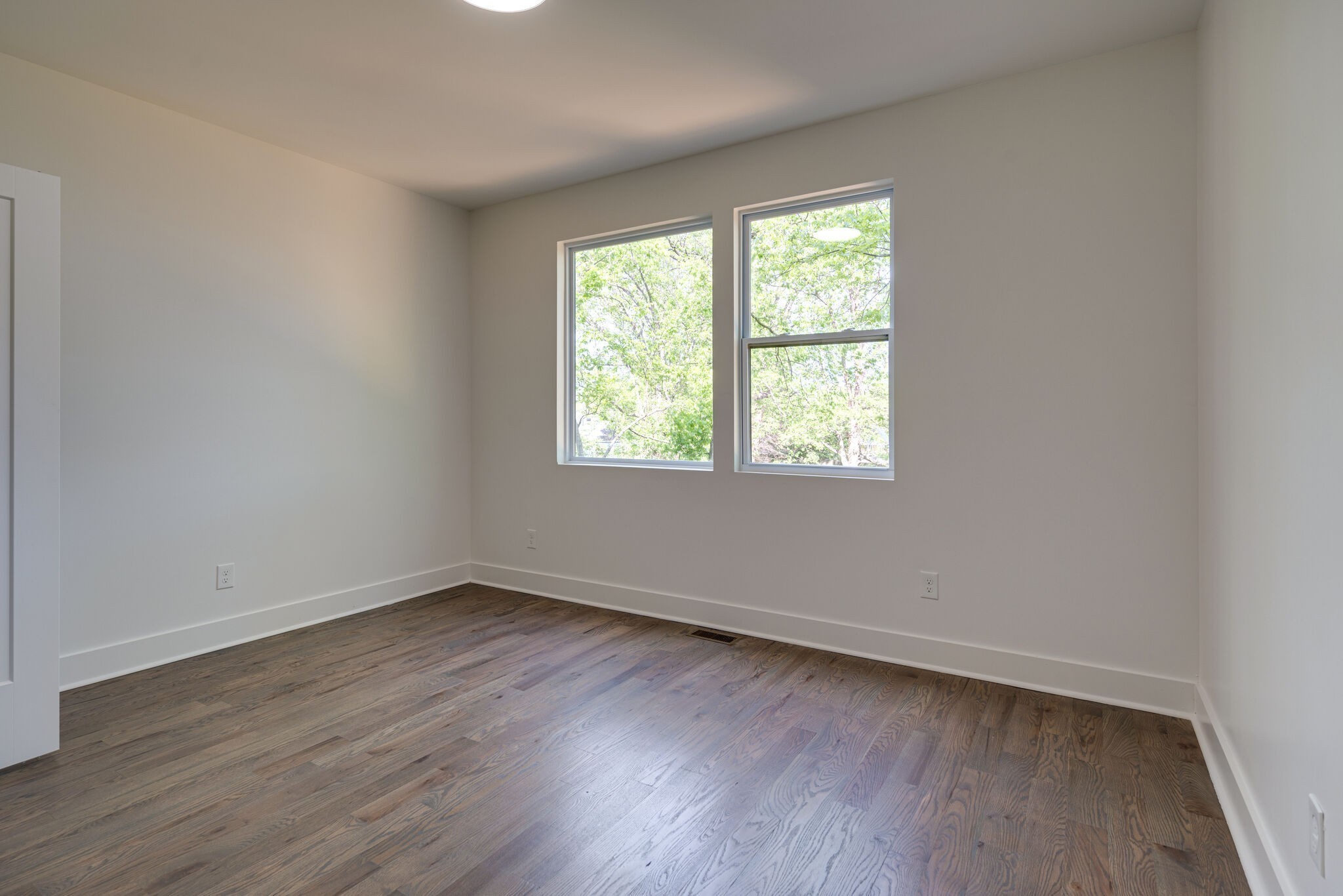 2005 Overby Road Nashville, TN 37207 - Photo 17 of 36 an empty room with wooden floor and windows