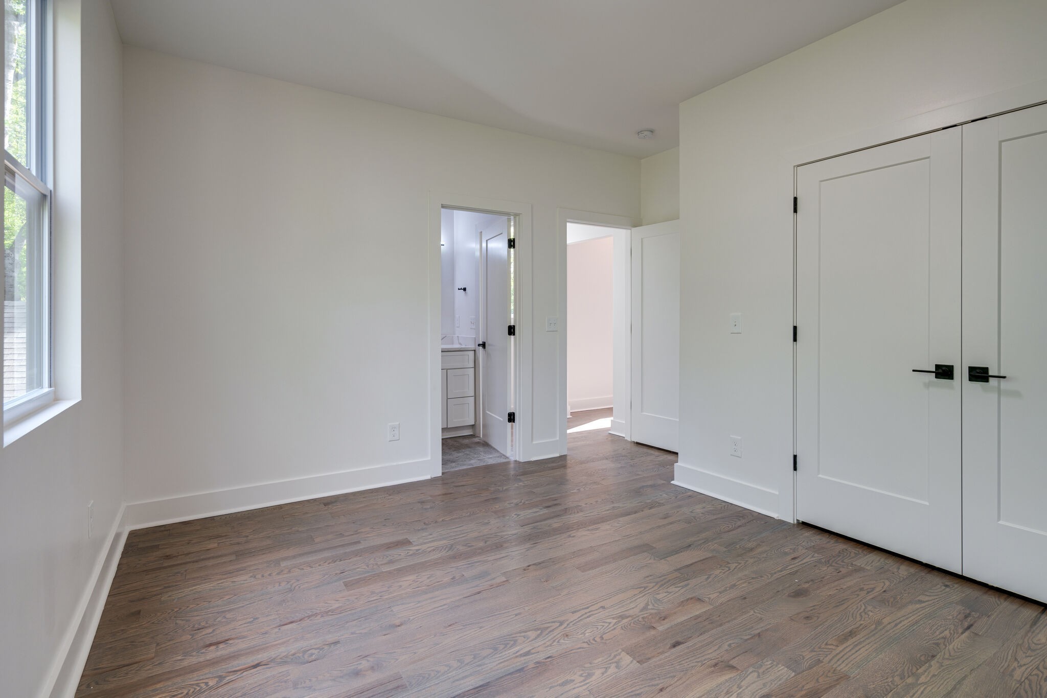 2005 Overby Road Nashville, TN 37207 - Photo 18 of 36 a view of an empty room with wooden floor and a window