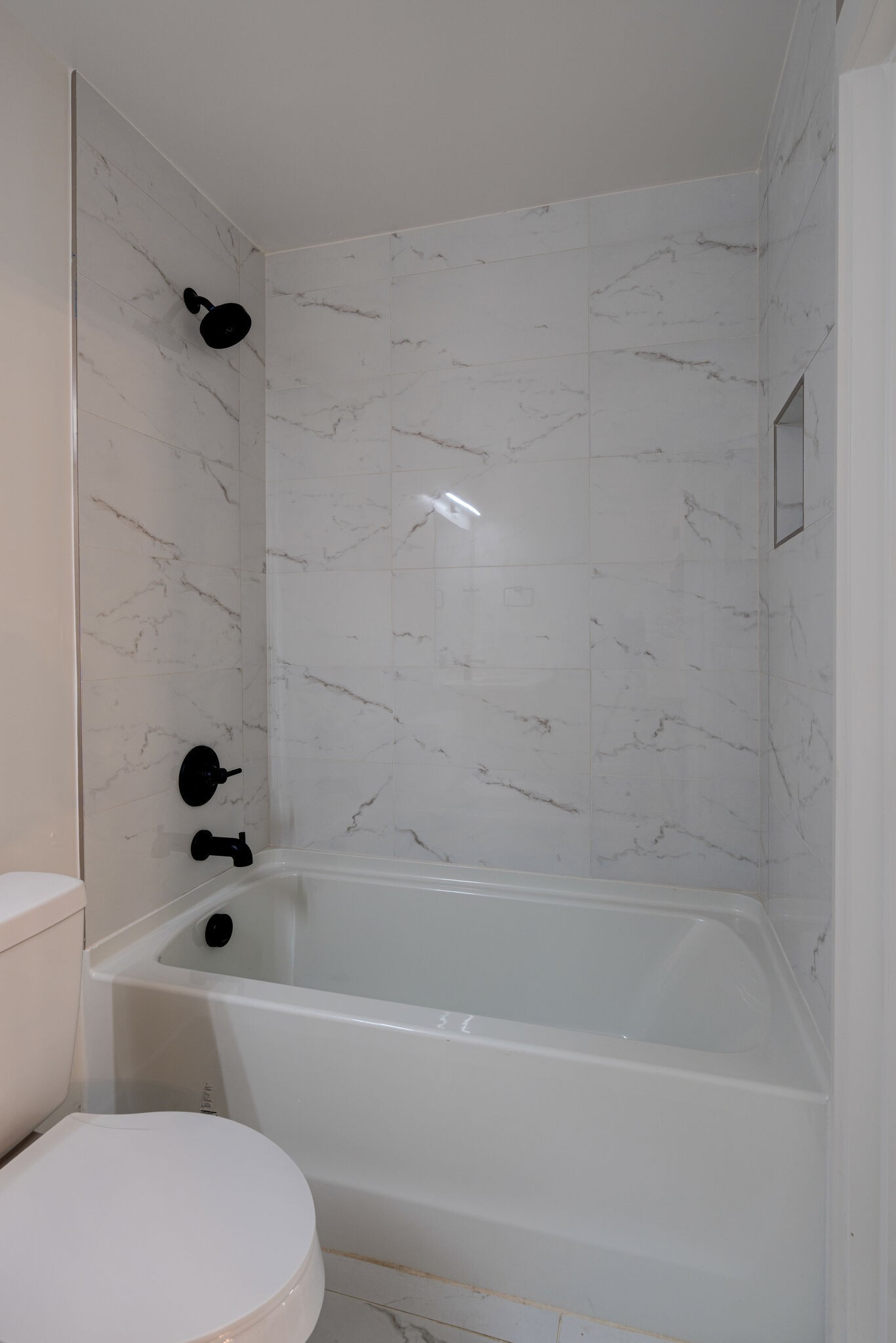 2005 Overby Road Nashville, TN 37207 - Photo 9 of 36 a bathroom with a bathtub and a toilet