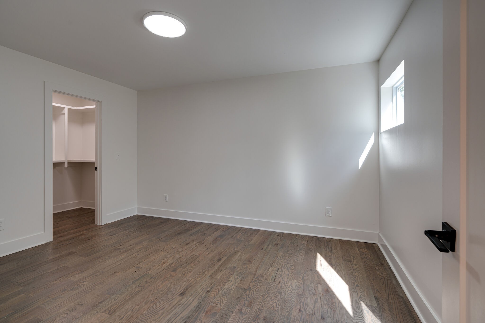 2005 Overby Road Nashville, TN 37207 - Photo 10 of 36 an empty room with wooden floor and windows