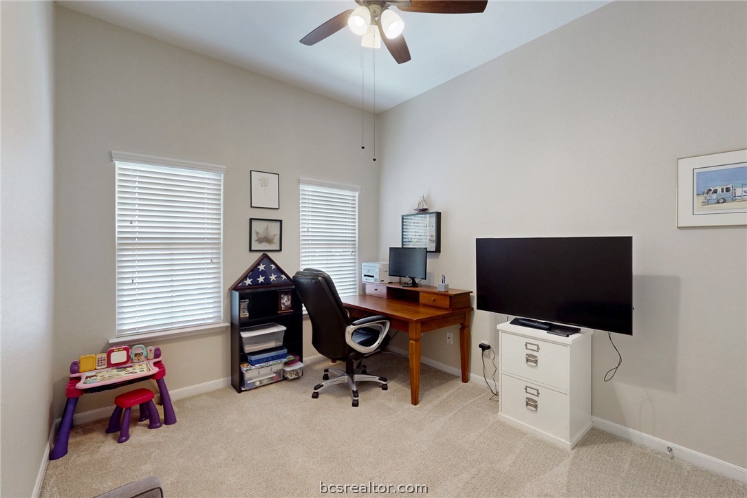 2071 Positano Loop Bryan, TX 77808 - Photo 18 of 31 a view of a workspace with furniture and a window
