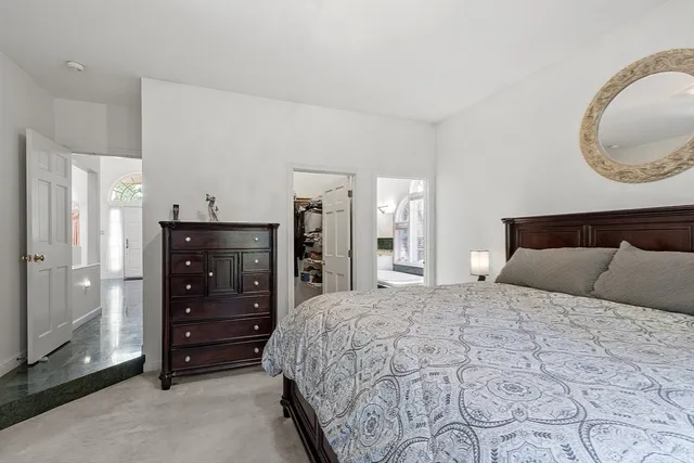 a bathroom with a sink a mirror and a shower