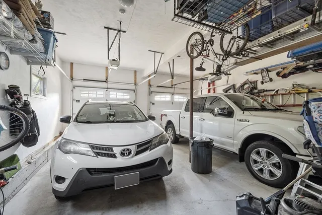 a view of a kitchen with cabinets appliances and a window