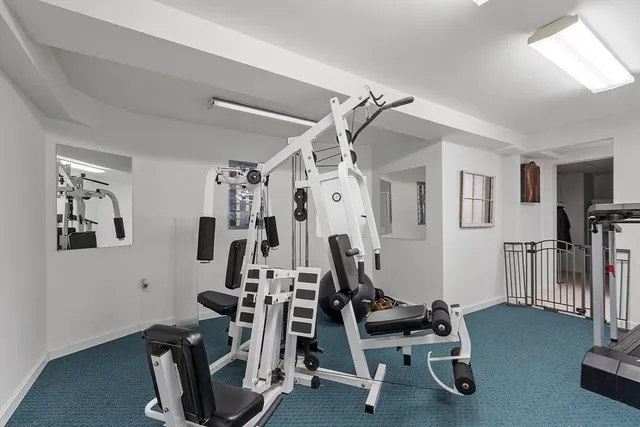 a bedroom with a bed and the wall painting