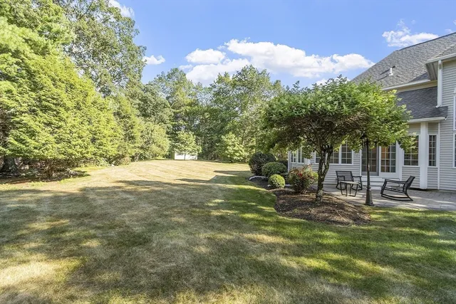 a view of house with outdoor space and swimming pool