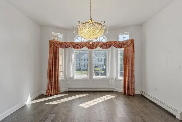 a living room with fireplace furniture and a flat screen tv