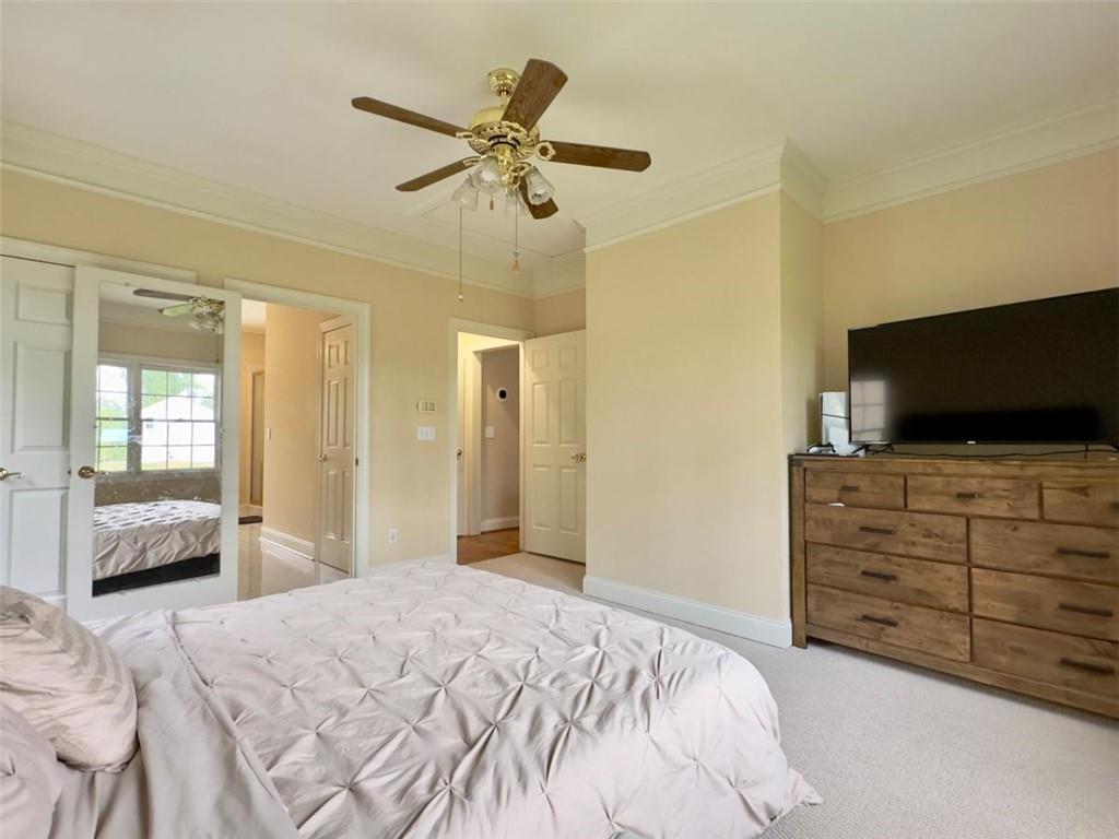 11 Stonegable Drive Northwest Rome, GA 30165 - Photo 16 of 32 a bedroom with a bed and flat screen tv