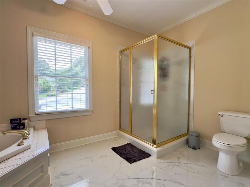 11 Stonegable Drive Northwest Rome, GA 30165 - Photo 17 of 32 a bathroom with a shower and a toilet