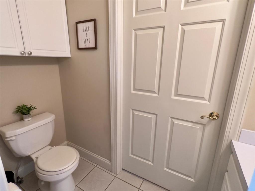 11 Stonegable Drive Northwest Rome, GA 30165 - Photo 24 of 32 a white toilet sitting next to a bathroom sink