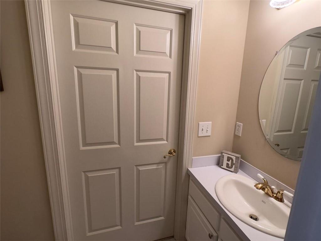 11 Stonegable Drive Northwest Rome, GA 30165 - Photo 25 of 32 a bathroom with a sink and a mirror
