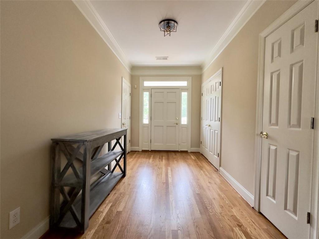 11 Stonegable Drive Northwest Rome, GA 30165 - Photo 7 of 32 a view of a hallway with wooden floor and staircase