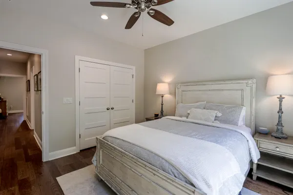 a bathroom with a double vanity sink toilet and mirror