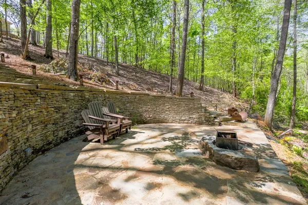 a backyard of a house with table and chairs