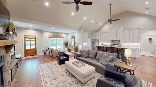 a living room with furniture or window and a wooden floor