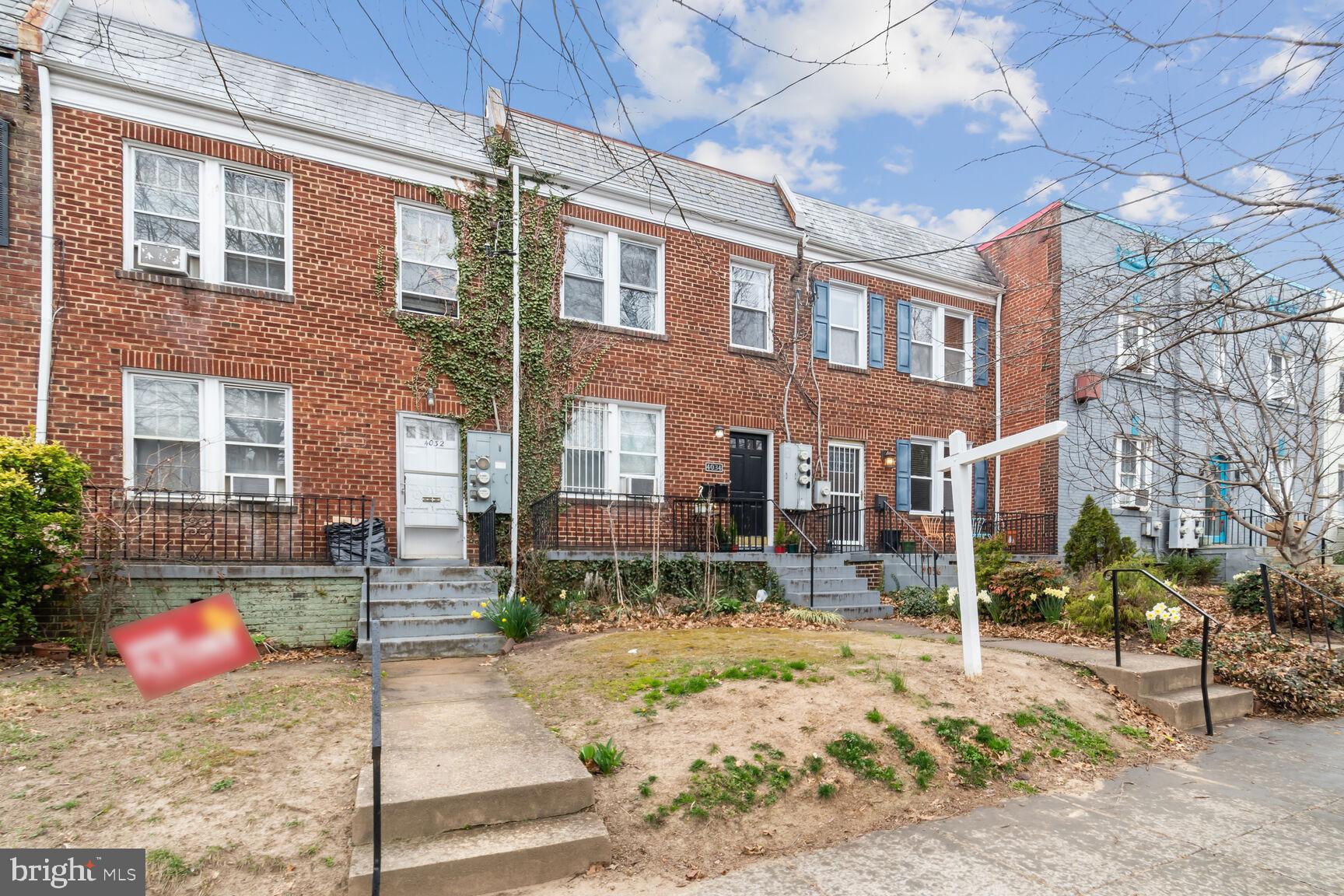 4034 7th Street Northeast, Unit 2 Washington, DC 20017 - Photo 1 of 9 a view of a brick building with many windows