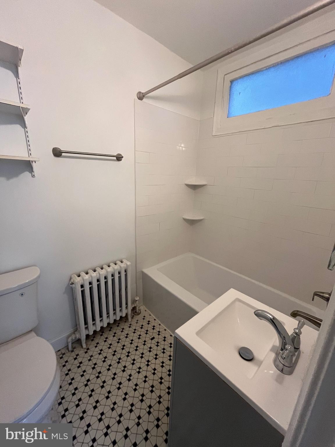 4034 7th Street Northeast, Unit 2 Washington, DC 20017 - Photo 7 of 9 a bathroom with a sink toilet and shower