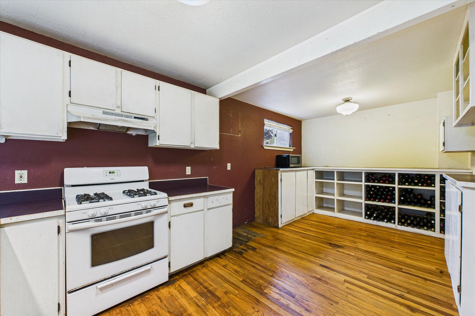 119 Sylva Street Arcata, CA 95521 - Photo 14 of 35 a kitchen with cabinets appliances and wooden floor