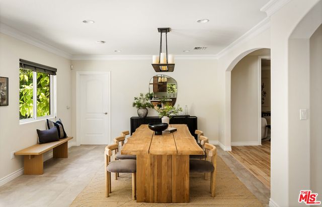 a room with table and chairs