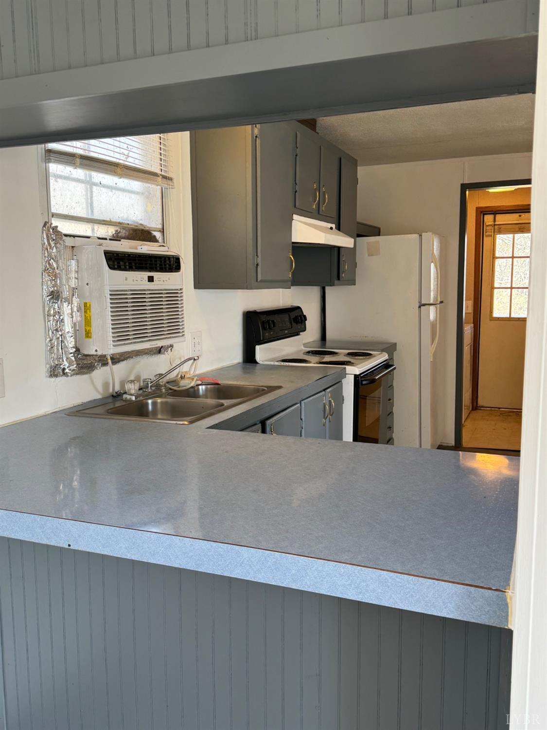 400 Pilot View Road Concord, VA 24538 - Photo 5 of 36 a kitchen with stainless steel appliances a sink a stove a microwave a refrigerator a counter top space and cabinets