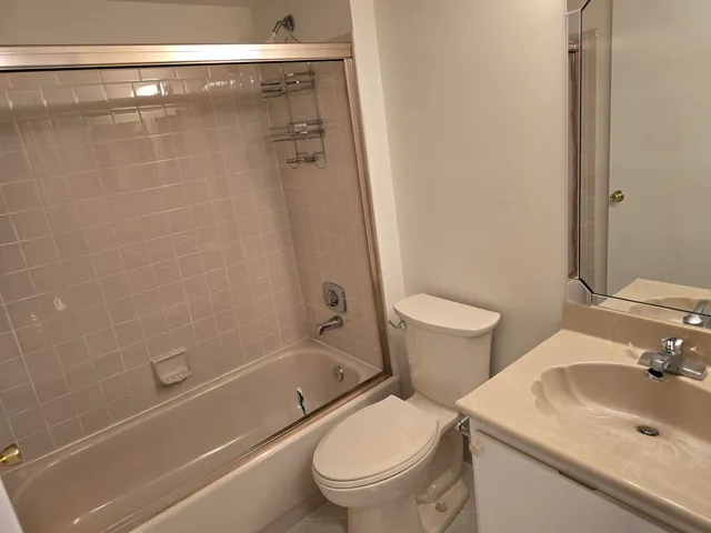 a view of an empty room with a fireplace