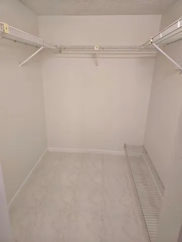 a view of a field of grass and trees