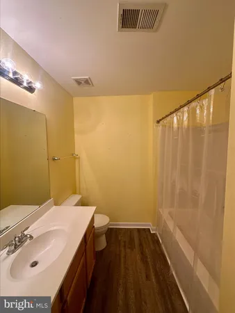 an empty room with a empty space and windows