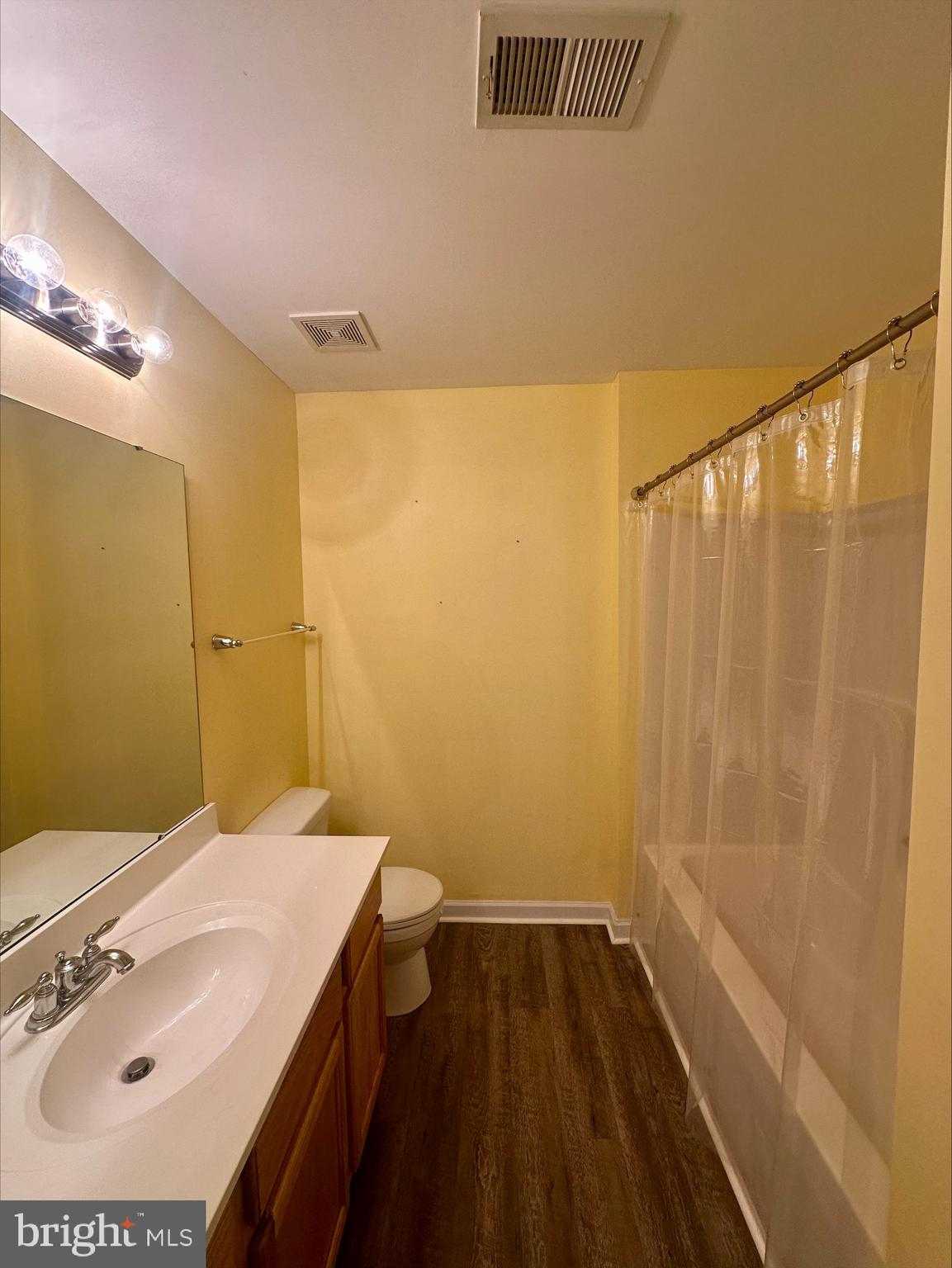 23567 Devonshire Road Millsboro, DE 19966 - Photo 21 of 25 a bathroom with a sink and a mirror