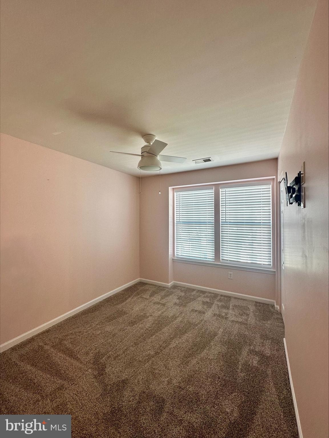 23567 Devonshire Road Millsboro, DE 19966 - Photo 22 of 25 an empty room with a empty space and windows